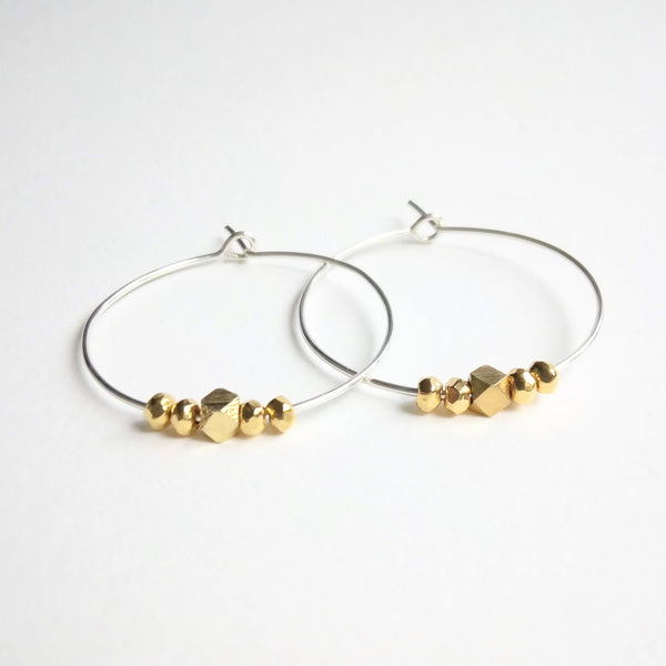 Medium sized simple hoops with geometric cut beads. Sterling silver wire and gold filled beads. 3cm diameter
