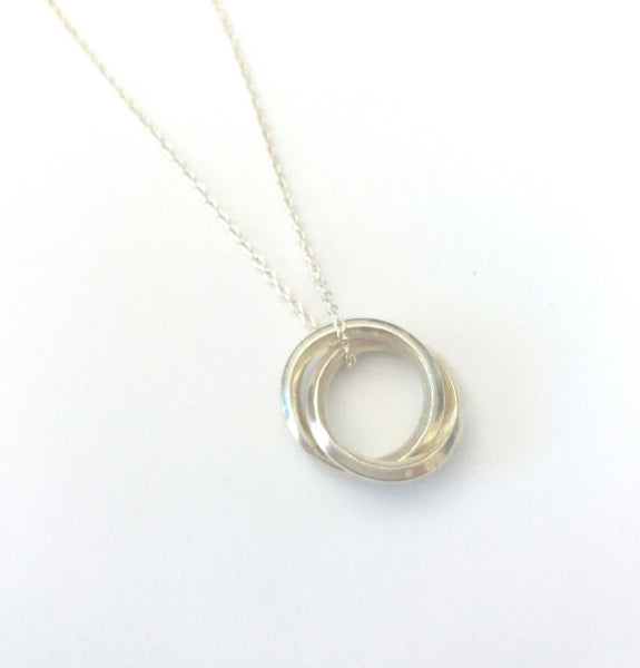 Two intertwined sterling silver loops hang from a fine sterling silver chain.
Chain length up to 50cm