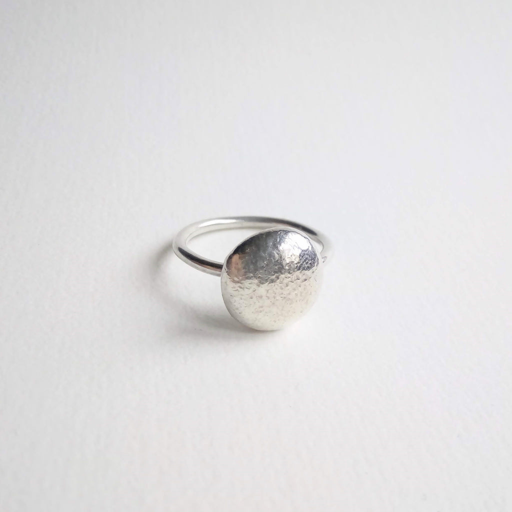 Sterling Silver pebbles of assorted sizes on a round wire band.