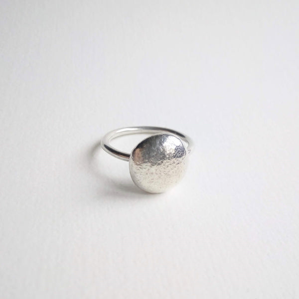 Sterling Silver pebbles of assorted sizes on a round wire band.