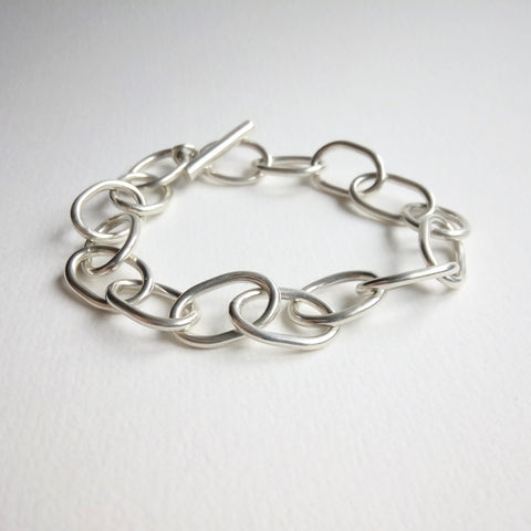 Contemporary sterling silver bracelet, shaped in chain link for an industrial chic look. 
